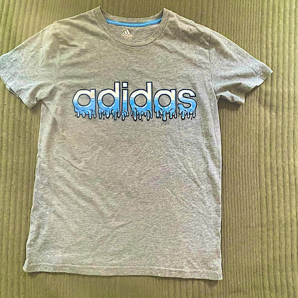 Grey Adidas T-shirt with drippy name in front.         SIZE: Youth LG